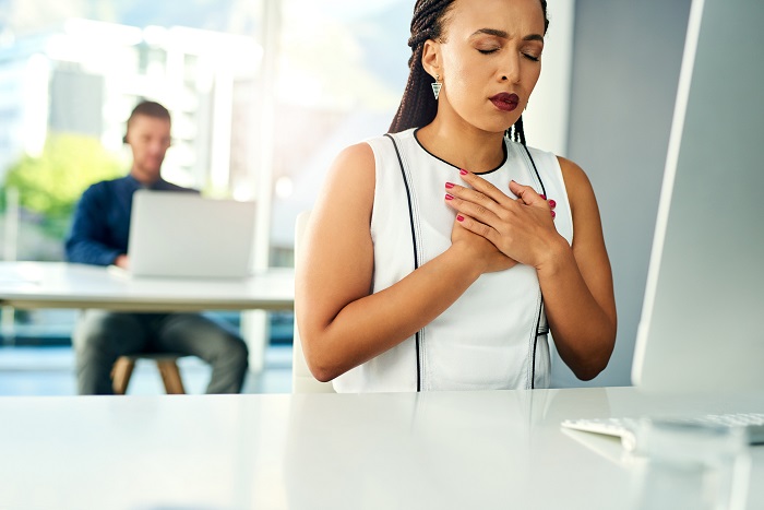 Lady with hands on chest